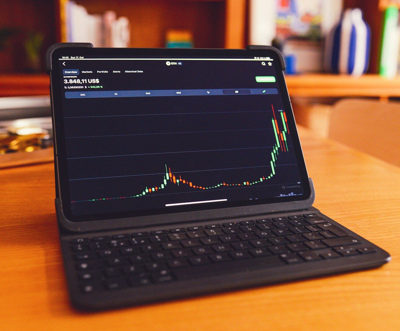 a laptop computer sitting on top of a wooden desk